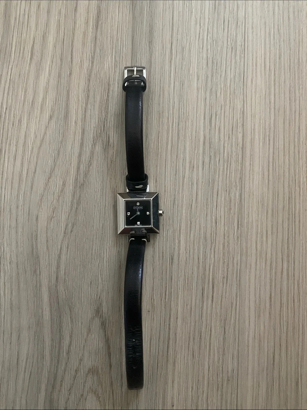 Coach woman’s  Black Leather Strap Watch with Square Silver Case
